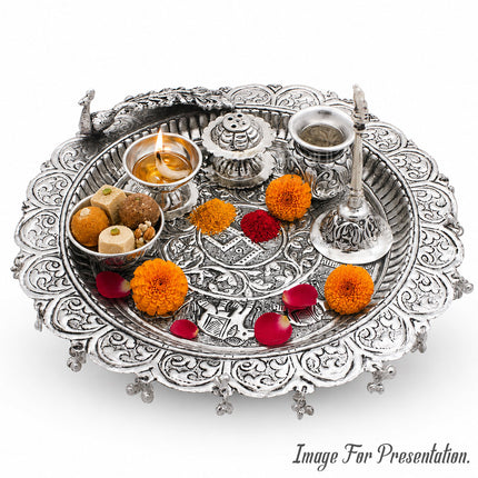 Traditional Silver-Plated Peacock Pooja Thali Set with Swastik Design, Bell, Diya Holder, Kalash & Incense Stand for Daily Worship and Festivals (12 inch diameter )